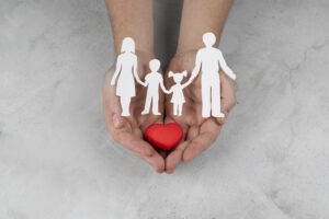 hands-holding-paper-people-heart-close-up-scaled.jpg